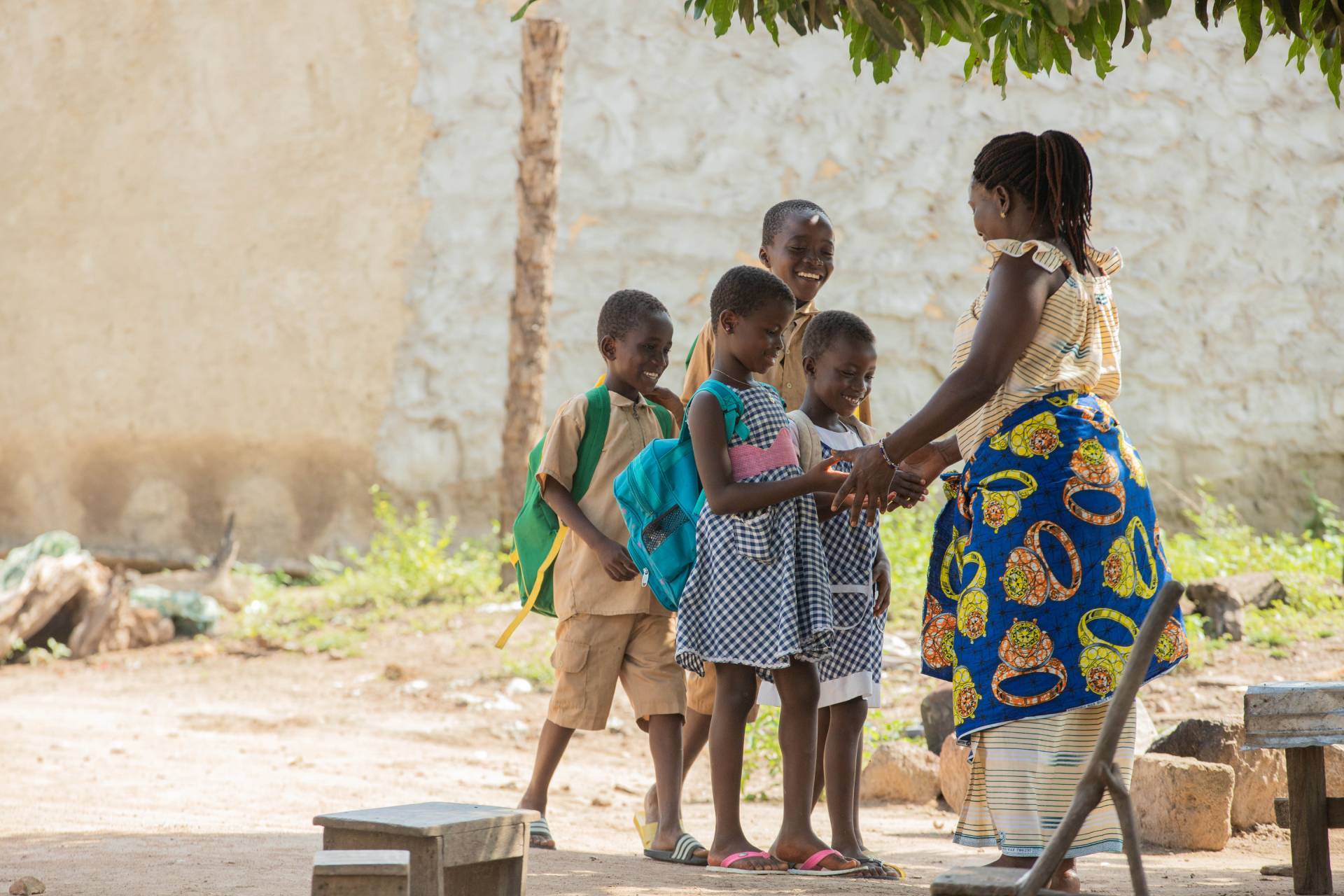 woman with four smilley kids